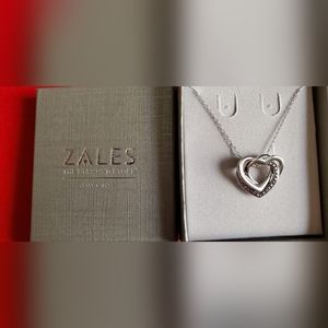 Diamond Accents interlocking heart pendant in sterling silver.